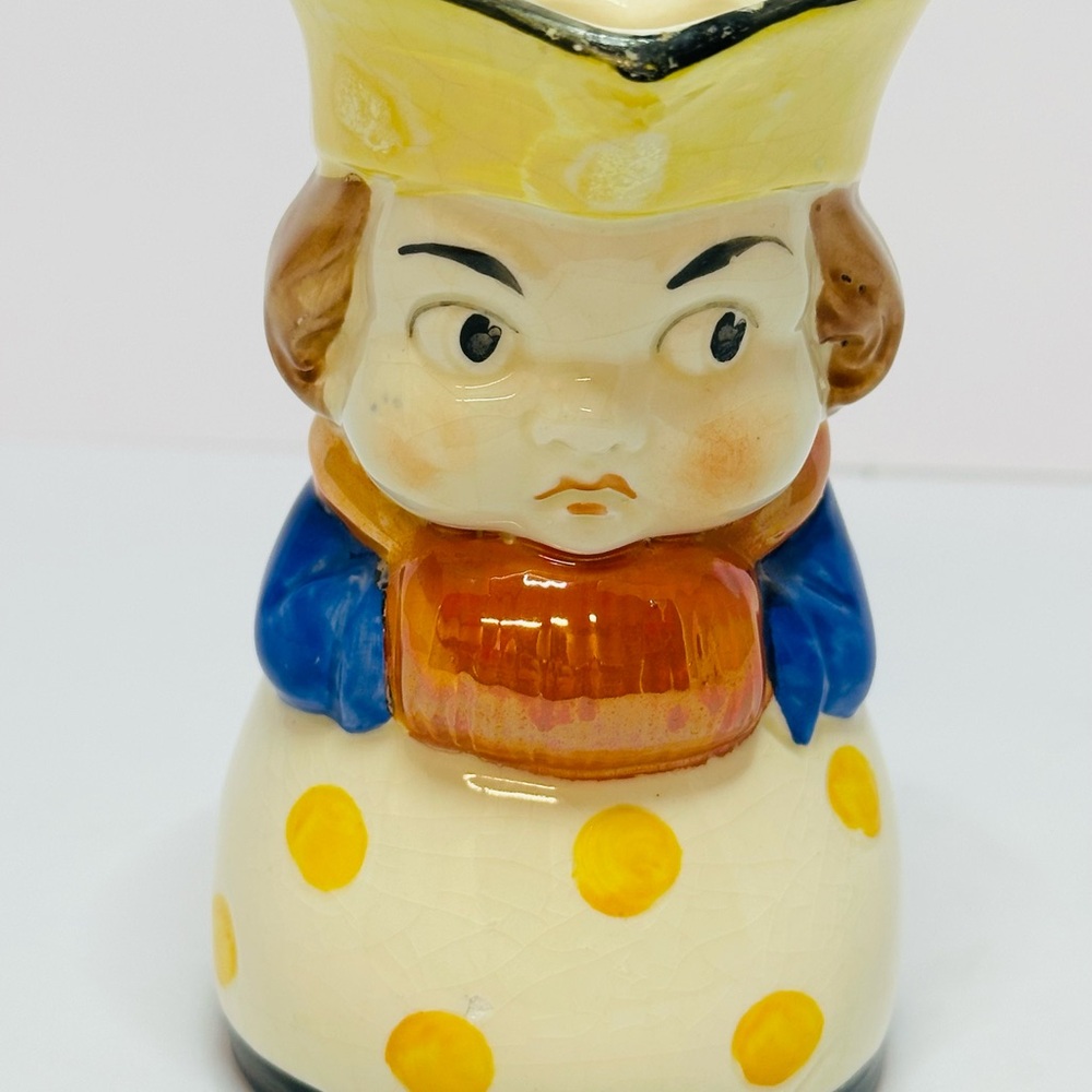 Charming Ceramic Figurine with Yellow and Blue Accents